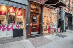 a store front of a store with a sign in front at Nolita 1br w wd nr shopping groceries NYC-1220 in New York