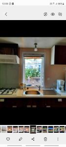 uma imagem de uma cozinha com um lavatório e uma janela em Mobile-home hyeres var climatisé dans camping avec piscine jusqu'à 6 personnes em Hyères