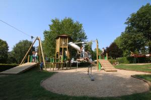 a park with a playground with a slide at Safari Tent M - Camp La Belle Vie in Berdorf