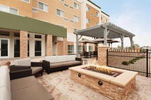 a patio with a fire pit in front of a building at Courtyard by Marriott El Paso East/I-10 in El Paso