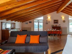 a living room with a couch and a table at Apartment Serenella by Interhome in Gravedona +30 photos