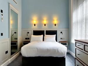 Letto o letti in una camera di Wynn's Hotel