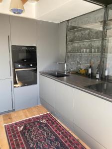 a kitchen with a counter and a sink and a counter top at Fam de Vida in Gratallops