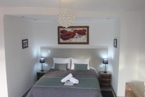 Postel nebo postele na pokoji v ubytování Casarão da Ducha hotel concept
