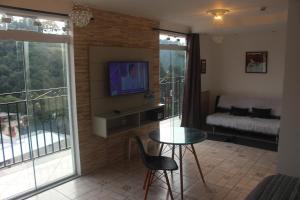 TV a/nebo společenská místnost v ubytování Casarão da Ducha hotel concept