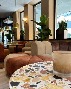 a lobby with couches and a table with a rug at Hotel Birger Jarl in Stockholm
