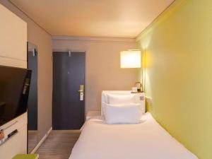 Postel nebo postele na pokoji v ubytování Mercure Nice Centre Grimaldi