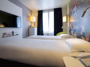 Postel nebo postele na pokoji v ubytování Mercure Nice Centre Grimaldi
