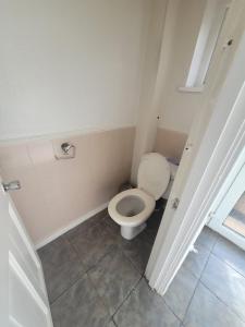 a bathroom with a white toilet in a room at HESFORD (A) in Manchester