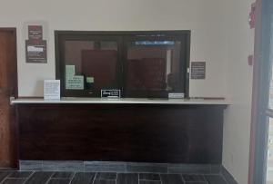 a counter in a room with a window at Red Roof Inn Huntsville, AL in Huntsville
