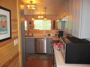 a kitchen with a sink and a counter top at SEWARD APARTMENT in Seward