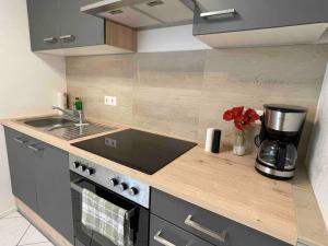 a kitchen with a counter top with a coffee maker at Auszeit am Gehrenberg in Markdorf