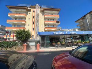a car parked in front of a building at Safran Apart Hotel in Alanya