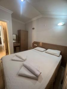 מיטה או מיטות בחדר ב-Safran Apart Hotel