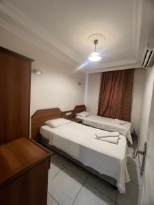 Un ou plusieurs lits dans un hébergement de l'établissement Safran Apart Hotel