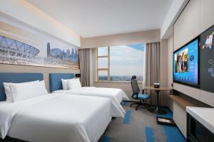 Televiisor ja/või meelelahutuskeskus majutusasutuses Hampton by Hilton Foshan Dali