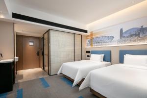 Voodi või voodid majutusasutuse Hampton by Hilton Foshan Dali toas