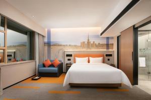 Voodi või voodid majutusasutuse Hampton by Hilton Foshan Dali toas