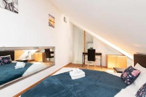 a bedroom with two beds and a staircase at Cozy 3 story house in Old Town in Tallinn