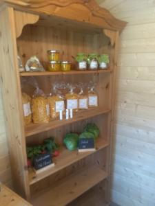 a shelf filled with lots of different types of food at Jochelerhof in Strass im Zillertal