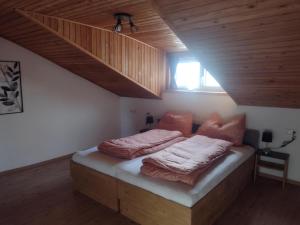 a bedroom with a bed with two pillows on it at Jochelerhof in Strass im Zillertal