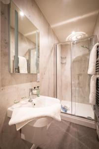 a bathroom with a sink and a shower at Ambleside Fell Rooms in Ambleside