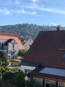 a group of houses with roofs and a car at 3Zimmerwohnung mit 58m2 und gutem Internet in Neumarkt in der Oberpfalz