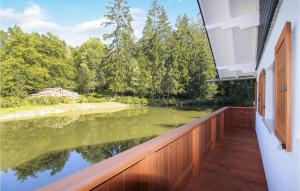 a balcony with a view of a lake at Stunning Home In Nahetal-waldau With Sauna in Hinternah