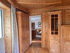 a hallway in a log home with wooden walls at SONNENLODGE St Anton am Arlberg in Sankt Anton am Arlberg