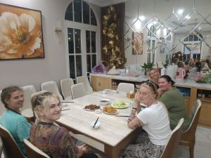 a group of women sitting at a table eating food at Huong Duong Sunflower in Ha Long