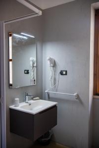 a bathroom with a sink and a mirror at Hotel Parco Carabella in Vieste +45 photos