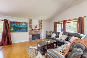 a living room with a couch and a fireplace at Lowell Place in Fremont