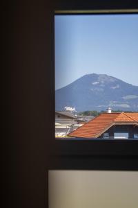 a view of a mountain from a window at Elmi 33 in Wals
