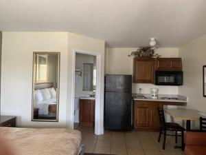 A kitchen or kitchenette at Paris Extended Stay Suites