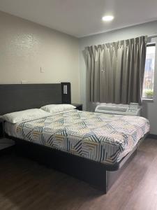 Voodi või voodid majutusasutuse Motel 6-Lantana West Palm Beach, FL toas
