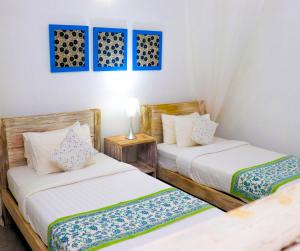 Postel nebo postele na pokoji v ubytování Esperanza Beach Mawella
