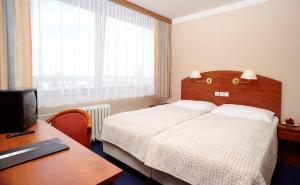 Voodi või voodid majutusasutuse Hotel Cernigov toas