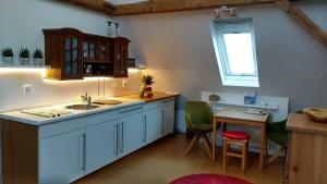 Kuchyň nebo kuchyňský kout v ubytování Ferienwohnung am Weidachbach