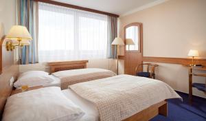 Voodi või voodid majutusasutuse Hotel Cernigov toas