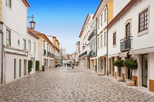 an empty street in an old town with buildings at Tomarhousing - 37 Old Town in Tomar