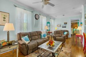 a living room with a couch and a table at Little Inn on Main in Washington