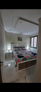 a bedroom with a large bed and a window at اقامة الحب in Nador