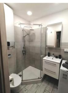 a bathroom with a shower and a toilet and a sink at Best Place for You in Batumi