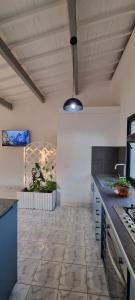 a kitchen with a tile floor and a ceiling at Flamingo résidence in Toliara