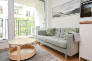 a living room with a couch and a table at Luxury apartment in city center in Bratislava