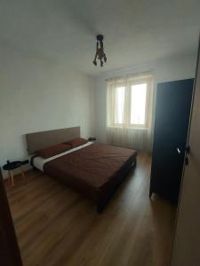 a bedroom with a large bed and a window at Casa a Rucas in Montoso