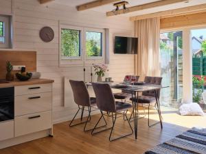 a kitchen and dining room with a table and chairs at Chalet in Köln - Tinyhouse in Cologne +11 photos
