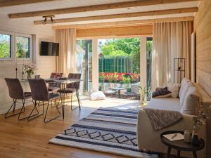 a living room with a couch and a table at Chalet in Köln - Tinyhouse in Cologne