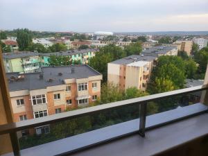 a view of a city from a balcony at Apartament bloc nou - self check in - free parking in Craiova