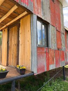 a building with two bowls of fruit on a deck at Tiny House - Chacras de Coria by Inside in Ciudad Lujan de Cuyo